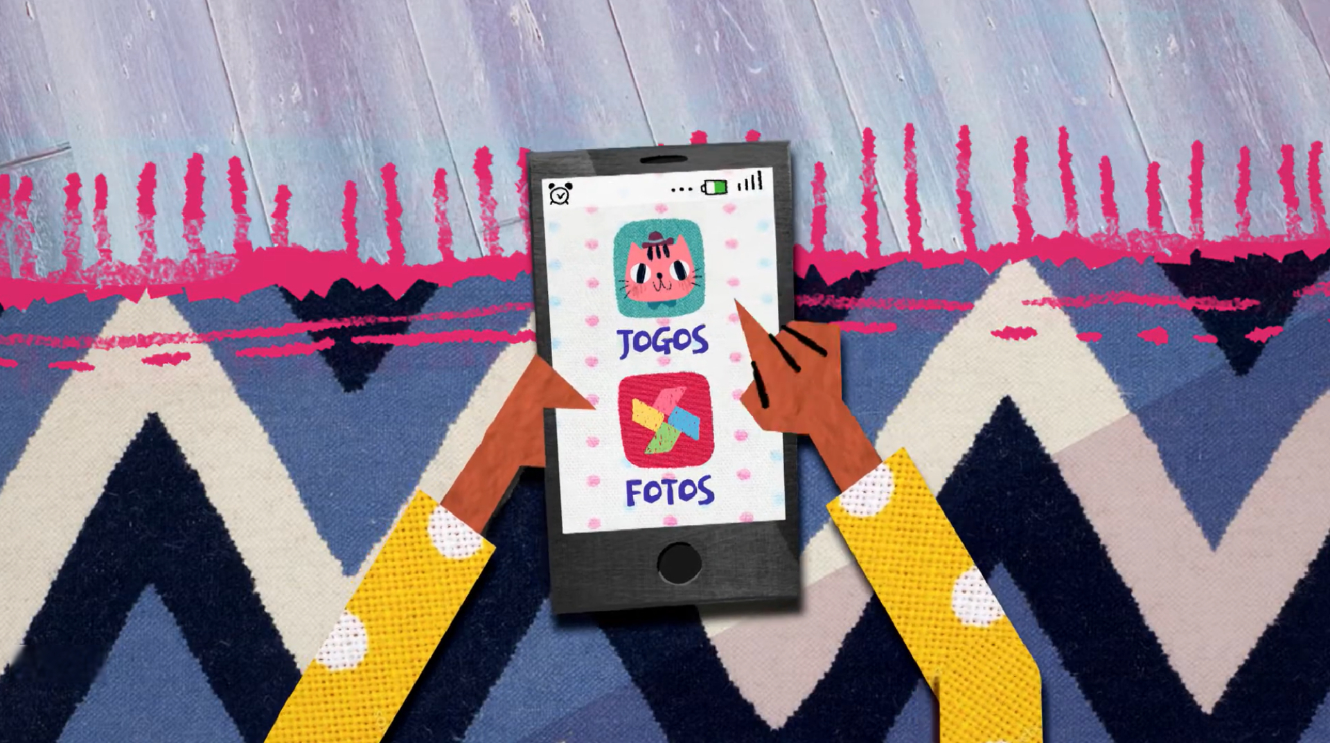 Ilustração de um celular visto de cima, apoiado sobre um tapete com padrões geométricos coloridos. Duas mãos estilizadas interagem com a tela, que exibe ícones de aplicativos como “Jogos” e “Fotos”, com desenhos lúdicos e cores vibrantes. A cena remete ao uso cotidiano do smartphone, especialmente por crianças, destacando o acesso a conteúdos digitais de forma interativa e visualmente atraente.