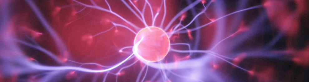 Uma imagem computadorizada de uma esfera rosada no centro da imagem com várias linhas roxas saindo dela
